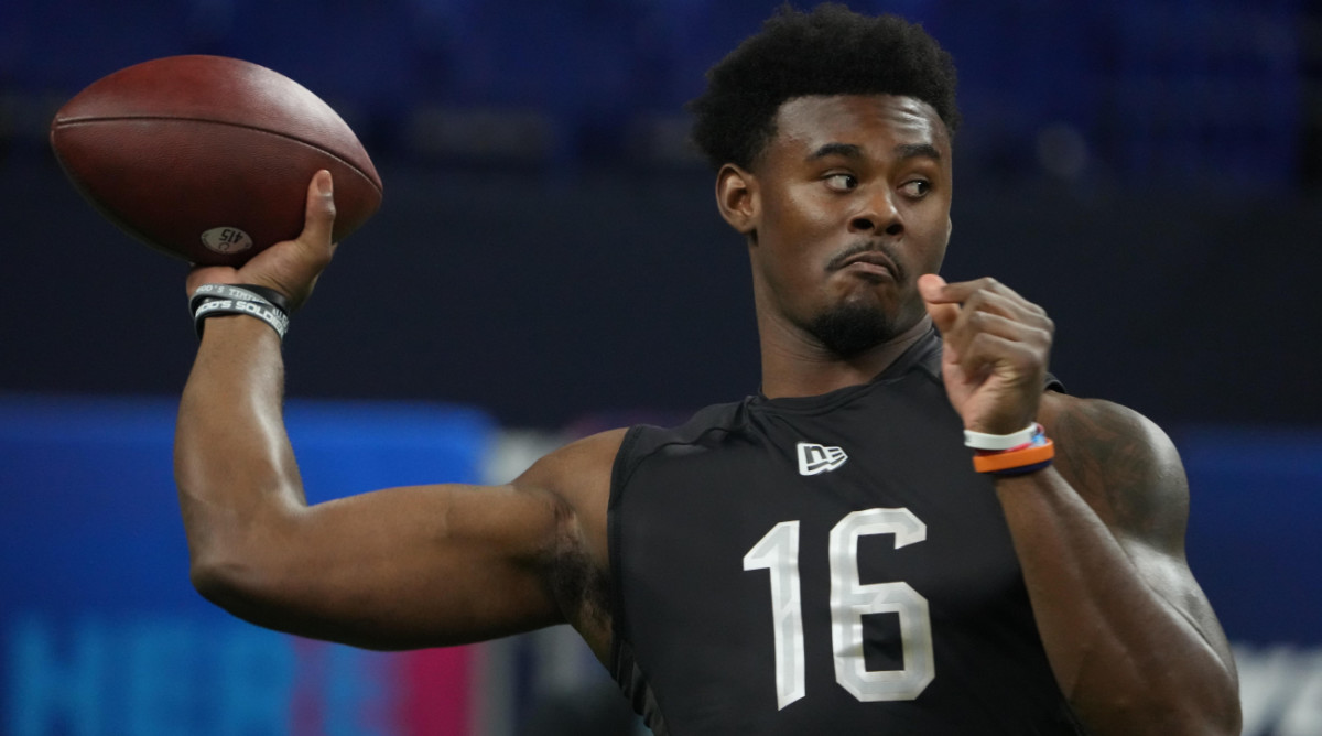 Liberty quarterback Malik Willis (QB16) goes through drills during the 2022 NFL Scouting Combine.